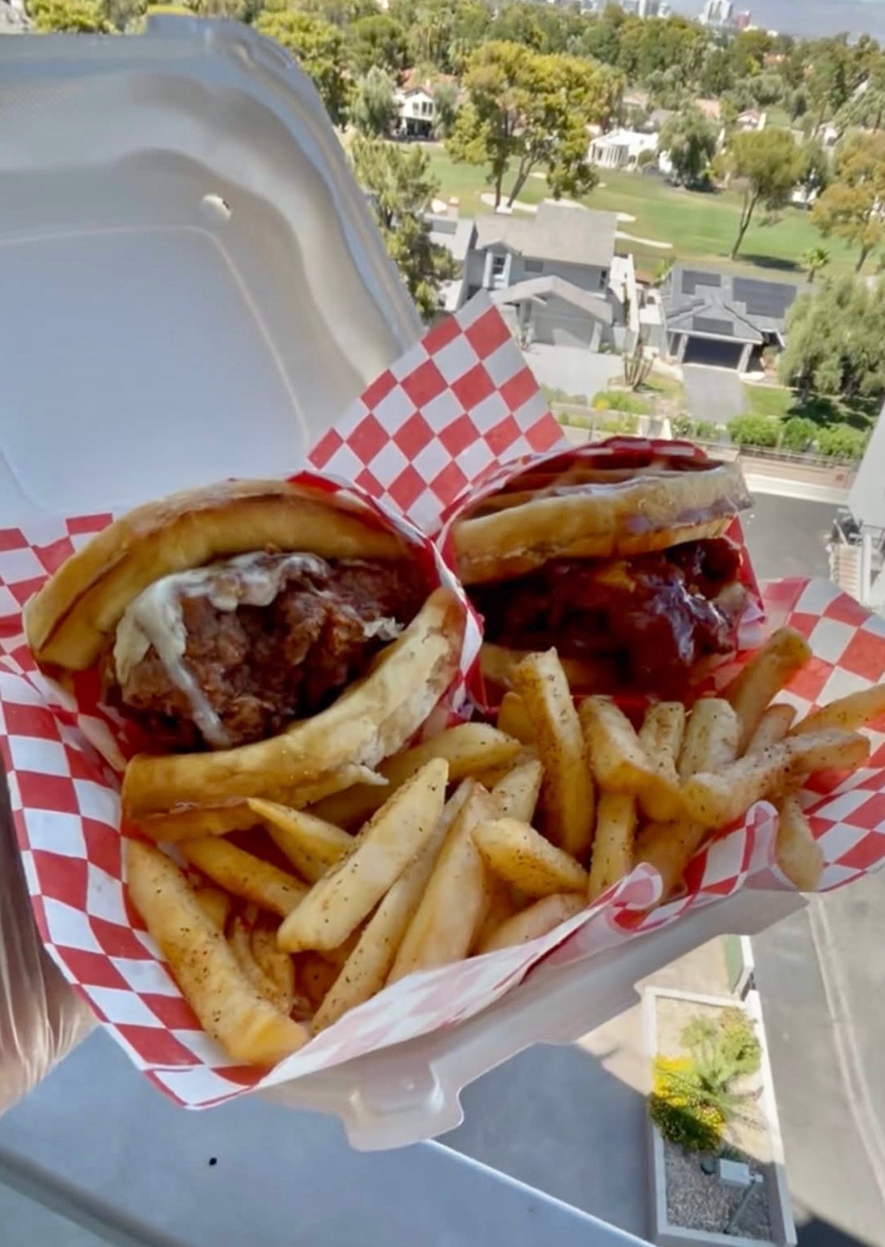 Hot Honey Waffle Chicken Sandwich with crispy chicken, waffle buns, and fries